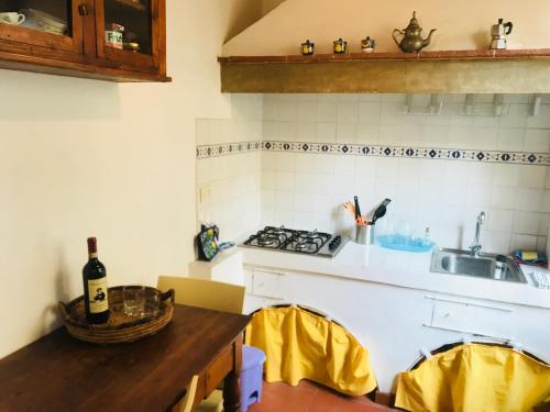 a kitchen with a sink and a stove and a counter at Gino's place in Florence