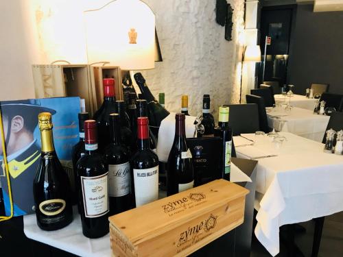 a bunch of bottles of wine sitting on a table at Locanda al Vescovo & SPA in Verona
