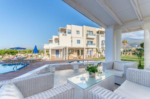 a view of a villa with a swimming pool at Pyrgos Blue in Malia