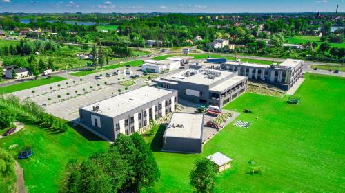 an aerial view of a large building in a park at Hotel Rondo in Wąbrzeźno