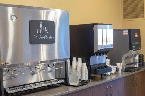 a kitchen with a coffee machine on a counter at Berlin Encore Hotel & Suites in Berlin