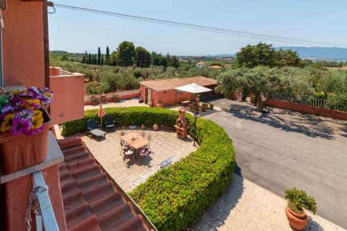 an overhead view of a patio with a table and chairs at Casale Gli Ulivi in Orbetello