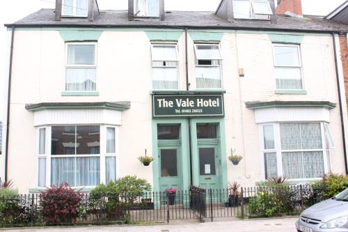 a white house with a sign for the vale hotel at The Vale Apart Hotel in Hull