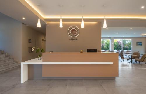 a lobby with a reception desk in a building at Hotel Esperia in Marmari