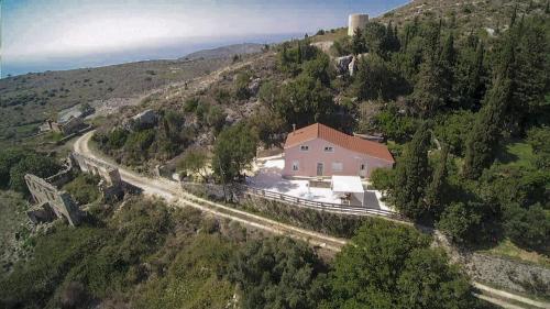 an aerial view of a house on a mountain at Villa Serenity in Vovikes