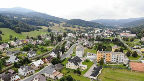 an aerial view of a small town in the mountains at Apartmá Andělka in Lipova Lazne