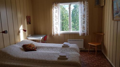Een bed of bedden in een kamer bij Solheim Pensjonat