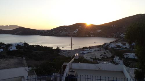 a view of a city and a body of water at Grandma Vasiliki Rooms To Let in Ios Chora