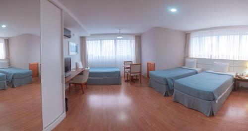 Säng eller sängar i ett rum på Salvador Business & Flat by Avectur