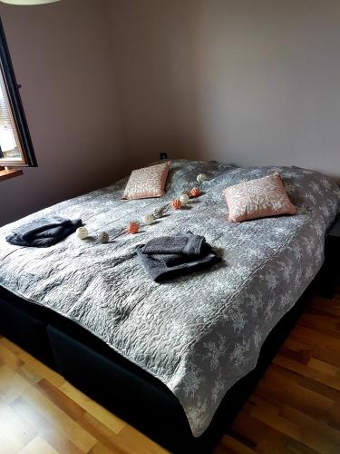 a bed with towels and pillows on top of it at Słoneczny in Kielce