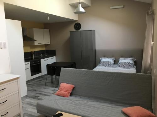 מיטה או מיטות בחדר ב-Appartements "Le 102"