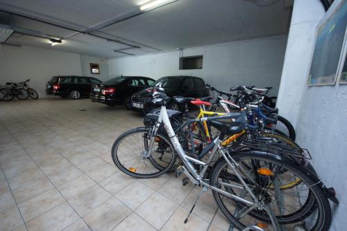 a group of bikes parked in a garage at Park Hotel Val Di Monte ***S in Malcesine