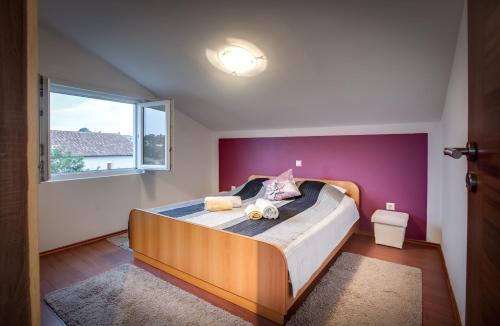 Postel nebo postele na pokoji v ubytování Apartman NANE