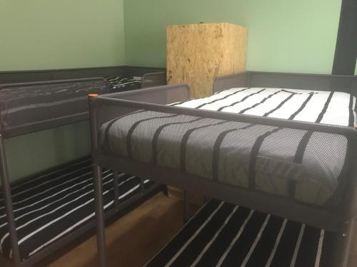 a bedroom with two bunk beds in a room at Wood Steel & Glass in Marinha Grande