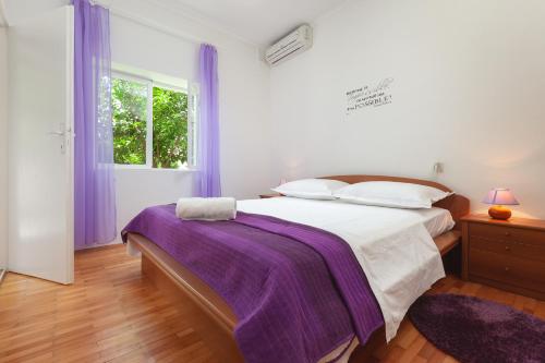 Postel nebo postele na pokoji v ubytování Apartments R