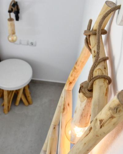 a close up of a wooden instrument at Angelos Boutique Suites in Patitiri