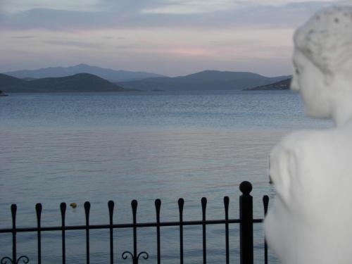 a statue looking out over the water at Blue Dreams in Almiropótamos
