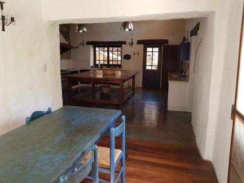 a kitchen and dining room with a table and chairs at El Molino de Cachi in Cachí