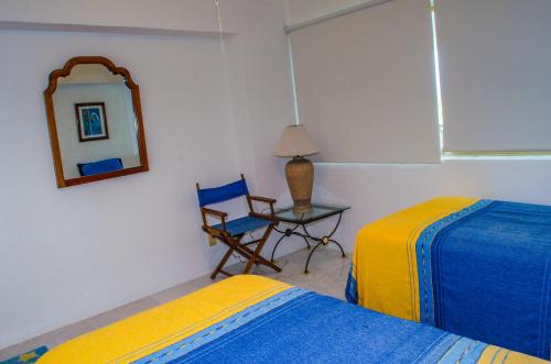 Ένα ή περισσότερα κρεβάτια σε δωμάτιο στο ENNA INN IXTAPA DEPARTAMENTOS ViSTA AL MAR