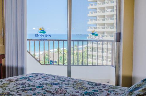 Ένα ή περισσότερα κρεβάτια σε δωμάτιο στο ENNA INN IXTAPA DEPARTAMENTOS ViSTA AL MAR