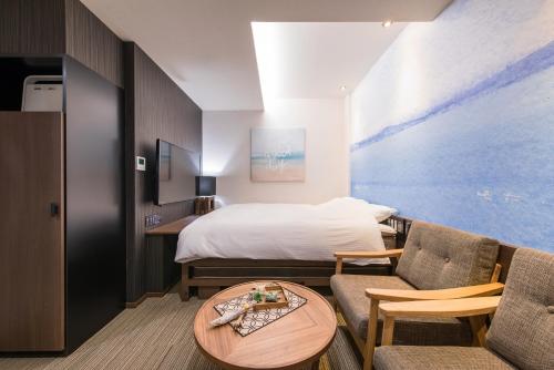 מיטה או מיטות בחדר ב-Enoca Hotel