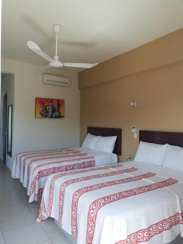 Ein Bett oder Betten in einem Zimmer der Unterkunft Hotel Nonni