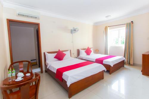 Katil atau katil-katil dalam bilik di Dong Do Hotel