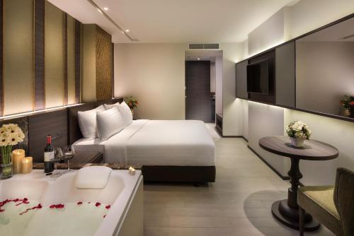 En eller flere senge i et værelse på Chillax Heritage Hotel Khaosan