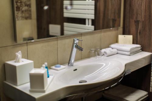 a bathroom with a sink and a mirror at Hotel Zeta in Budva