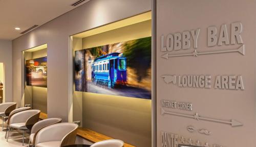 a restaurant with a train mural on the wall at Best Western Premier Hotel Dante in Barcelona