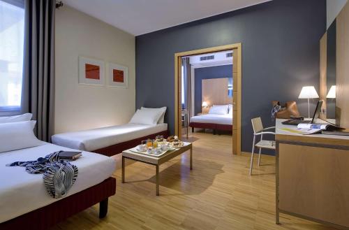 A bed or beds in a room at Best Western Plus Hotel Bologna