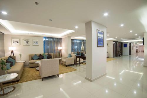 Coin salon dans l'établissement Tulip Inn - Taskeen Served Apartment