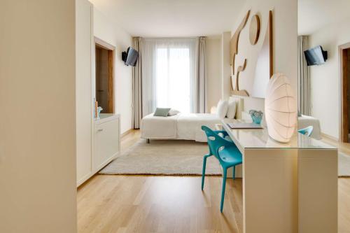 a living room with a desk and a bedroom at Best Western Plus Leone di Messapia Hotel & Conference in Lecce
