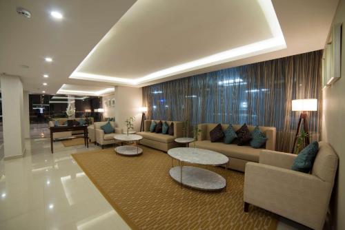 Coin salon dans l'établissement Tulip Inn - Taskeen Served Apartment