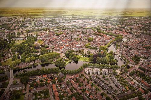an aerial view of a city with a river at Best Western City Hotel Woerden in Woerden