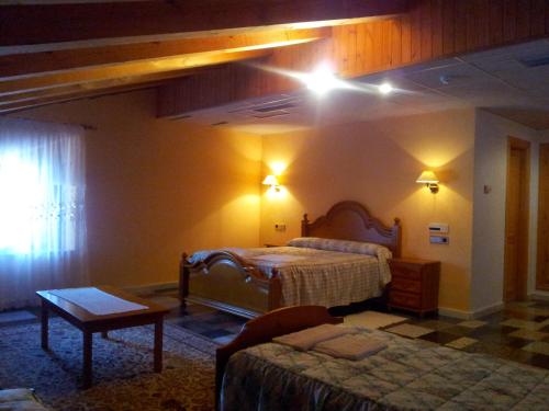 Katil atau katil-katil dalam bilik di Hostal Casa Ramón