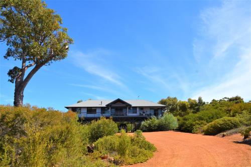a house sitting on top of a dirt road at Surinam in Dunsborough