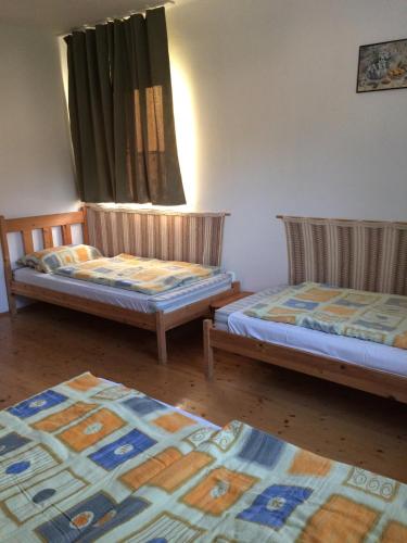 Postel nebo postele na pokoji v ubytování Fasor vendégház
