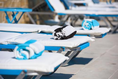 a row of empty beds in a hospital at Angelo Del'Arte Estate in Corfu Town