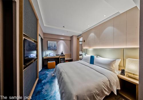 Ένα ή περισσότερα κρεβάτια σε δωμάτιο στο Royce Hotel Shenzhen