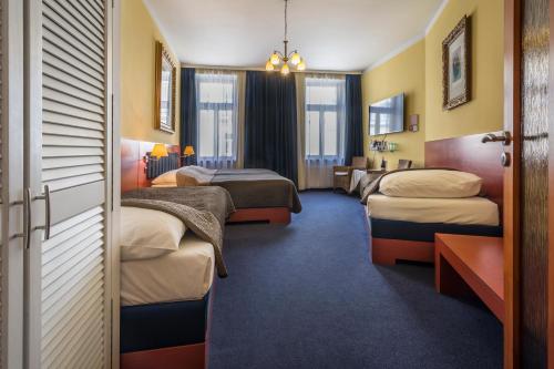 Ένα ή περισσότερα κρεβάτια σε δωμάτιο στο Hotel Arte