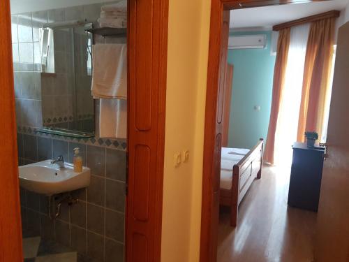 a bathroom with a sink and a mirror at Villa Luka in Brela
