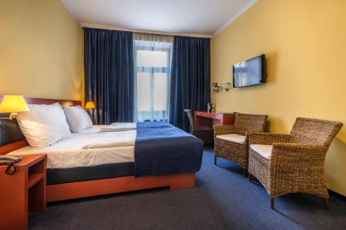 Una cama o camas en una habitación de Hotel Arte
