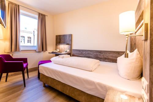 Ένα ή περισσότερα κρεβάτια σε δωμάτιο στο Hotel Am Alten Hafen