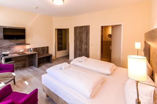 Ένα ή περισσότερα κρεβάτια σε δωμάτιο στο Hotel Am Alten Hafen