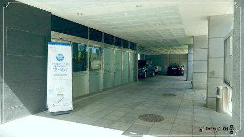 an empty hallway of a building with cars parked at Residence Mumum Hotel in Busan