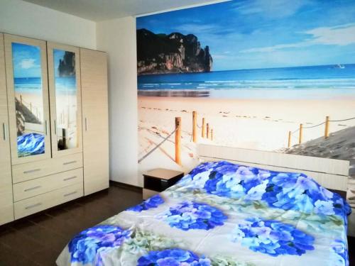 a bedroom with a mural of the beach at Cazare Balliu in Corbu