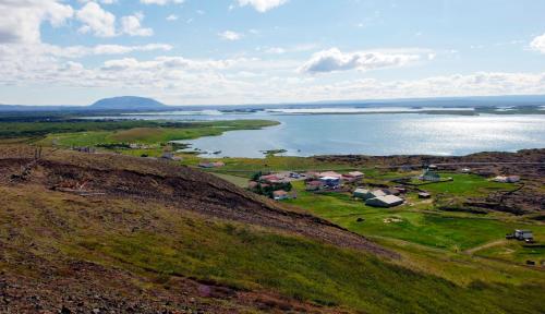a view of a large body of water from a hill at Hlid Bed and Breakfast in Myvatn