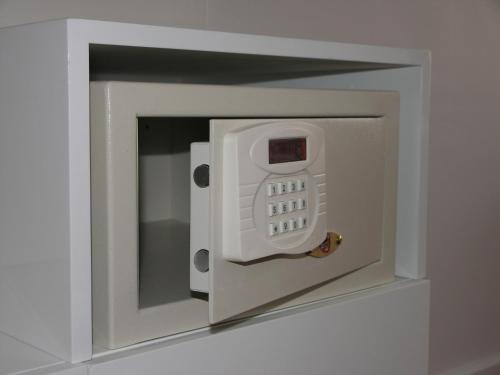a white microwave with a phone inside of it at Hotel Bayer's in Munich