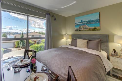 a bedroom with a large bed and a large window at Blue Angels Room Mercer Island in Mercer Island